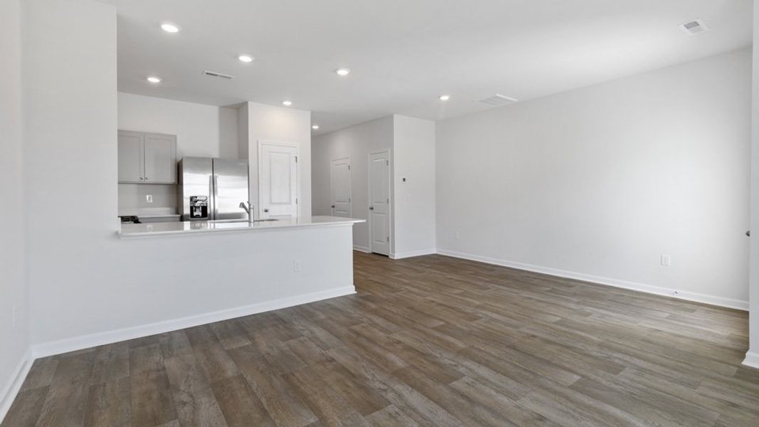 Spacious, unfurnished interior of a new home in The Townes at Bexford, Willow Spring (Image 6).