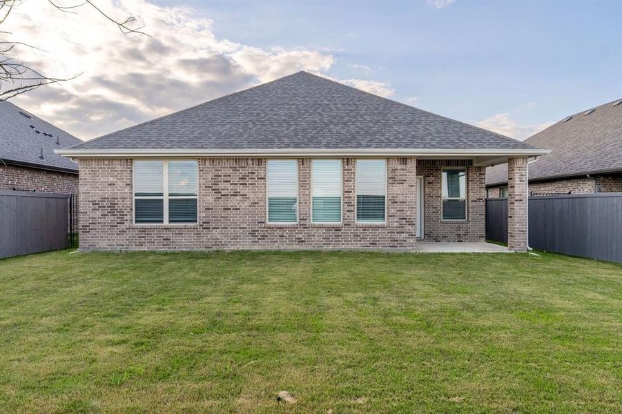 Exterior details and patio area of a home in Prairie Ridge at Goodland, Midlothian (Image 4).