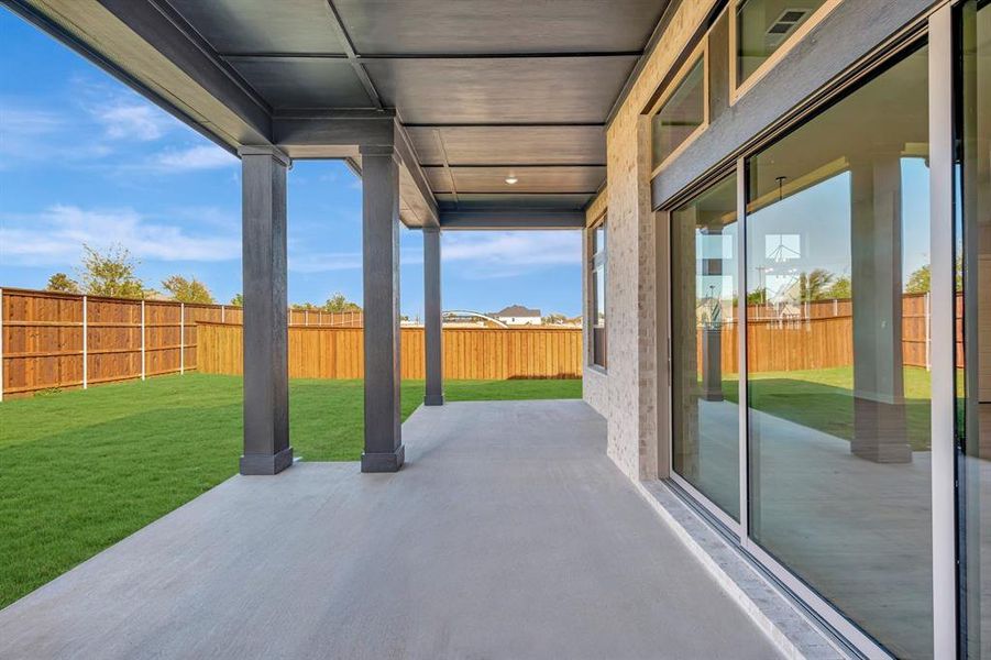 Exterior details and patio area of a home in Northshore at Lakewood Village - Garden Series, Lakewood Village (Image 2).