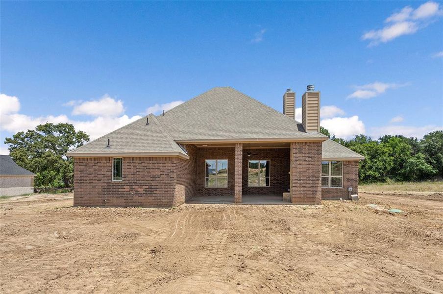 Rear view of house featuring a patio