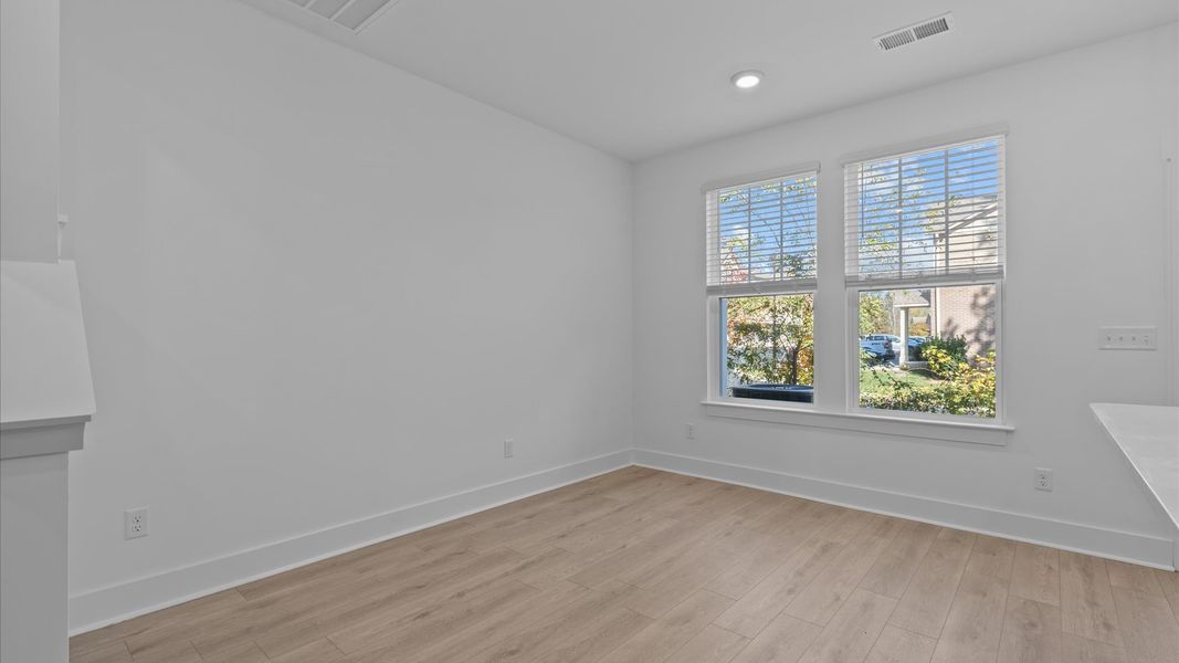 Tasteful dining area with current design in this vibrant two-story townhome near Greenville