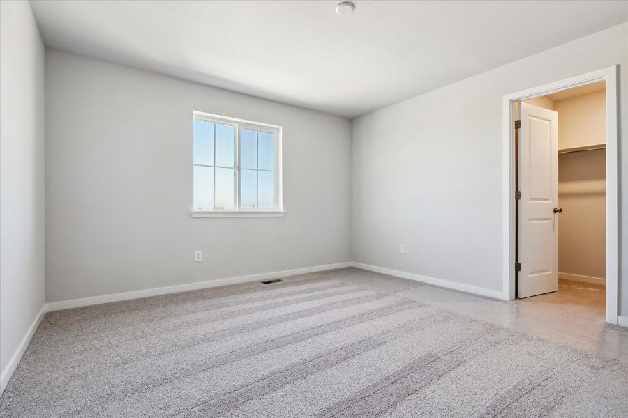 A room with a door and a window.