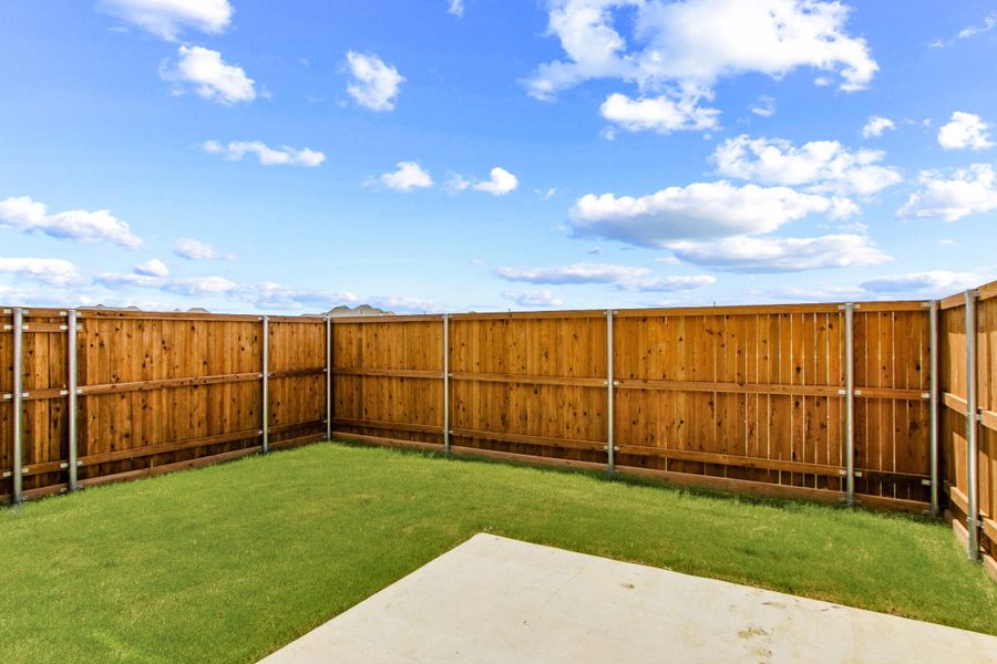 Exterior details and patio area of a home in Wildridge, Oak Point (Image 26).