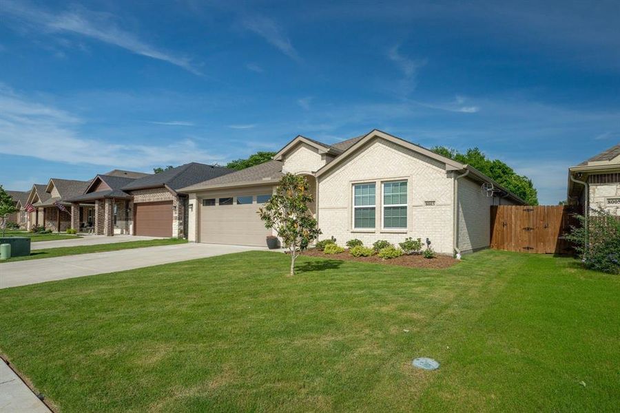 Front exterior of a new home in , Greenville, TX, highlighting curb appeal (Image 23).