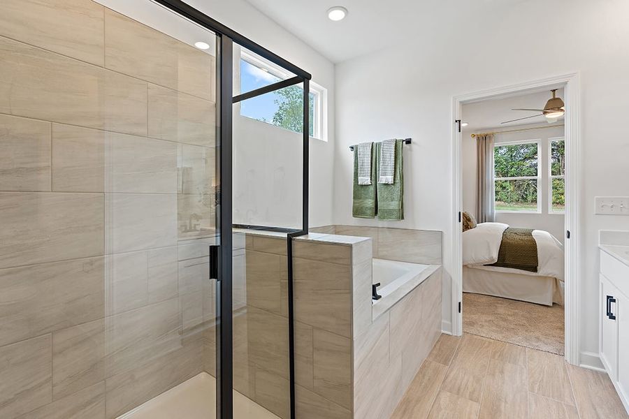 A bathroom with a glass shower. A bathroom with a glass shower.