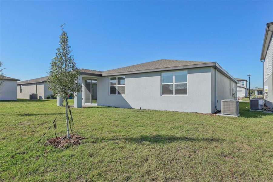 Exterior details and patio area of a home in The Reserve at Twin Lakes, St. Cloud (Image 3).