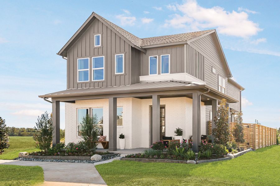 Front exterior of a new home in Indigo - Cottages Row Collection, Richmond, TX, highlighting curb appeal (Image 1). Front exterior of a new home in Indigo - Cottages Row Collection, Richmond, TX, highlighting curb appeal (Image 1).