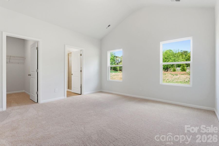 Primary Bedroom with Vaulted Ceiling