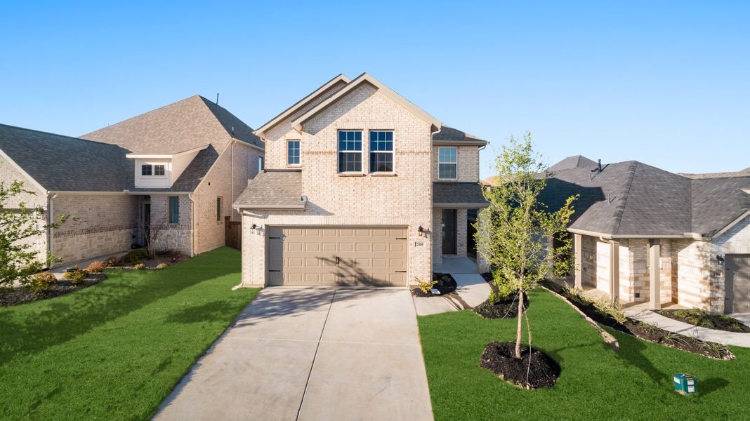 Front exterior of a new home in Reunion, Rhome, TX, highlighting curb appeal (Image 20).