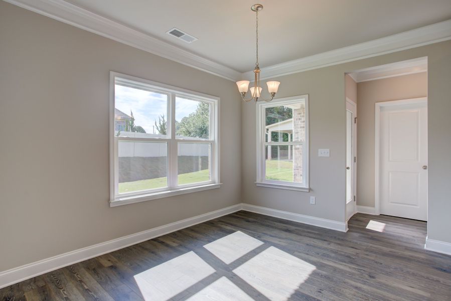 Centrally located kitchen with large island and breakfast area