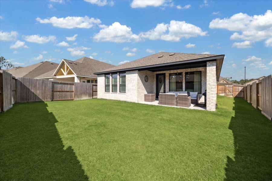 Expansive, fully fenced backyard offering privacy and plenty of space for pets, play, or future garden additions.