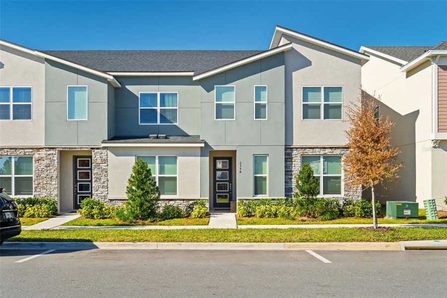 Front exterior of a new home in , Kissimmee, FL, highlighting curb appeal (Image 1). Front exterior of a new home in , Kissimmee, FL, highlighting curb appeal (Image 1).