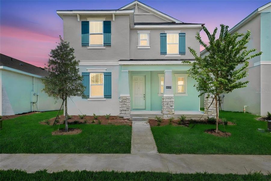 Front exterior of a new home in Crossroads at Kelly Park, Apopka, FL, highlighting curb appeal (Image 22).