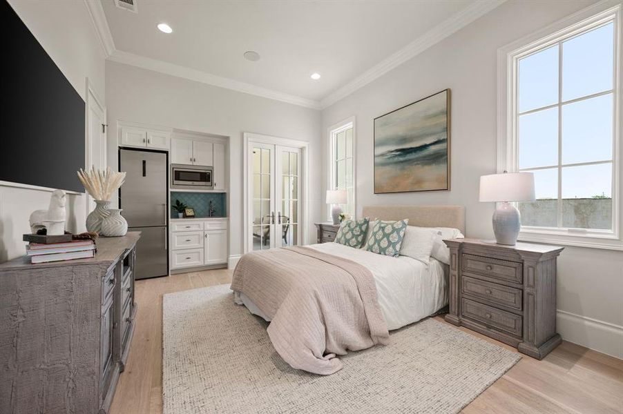 Bedroom with freestanding refrigerator, multiple windows, crown molding, light wood-type flooring, and recessed lighting Bedroom with freestanding refrigerator, multiple windows, crown molding, light wood-type flooring, and recessed lighting