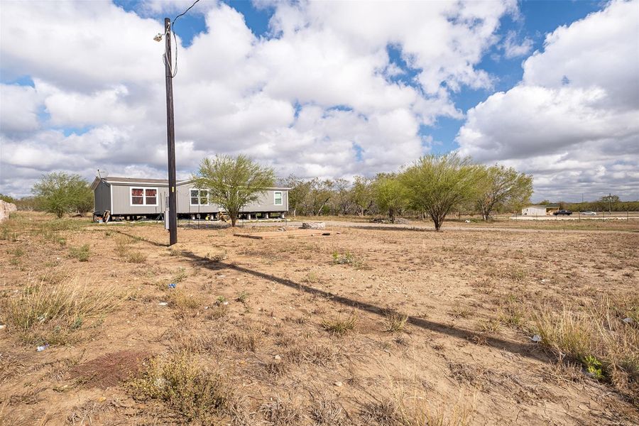 View of yard with a view of rural / pastoral area
