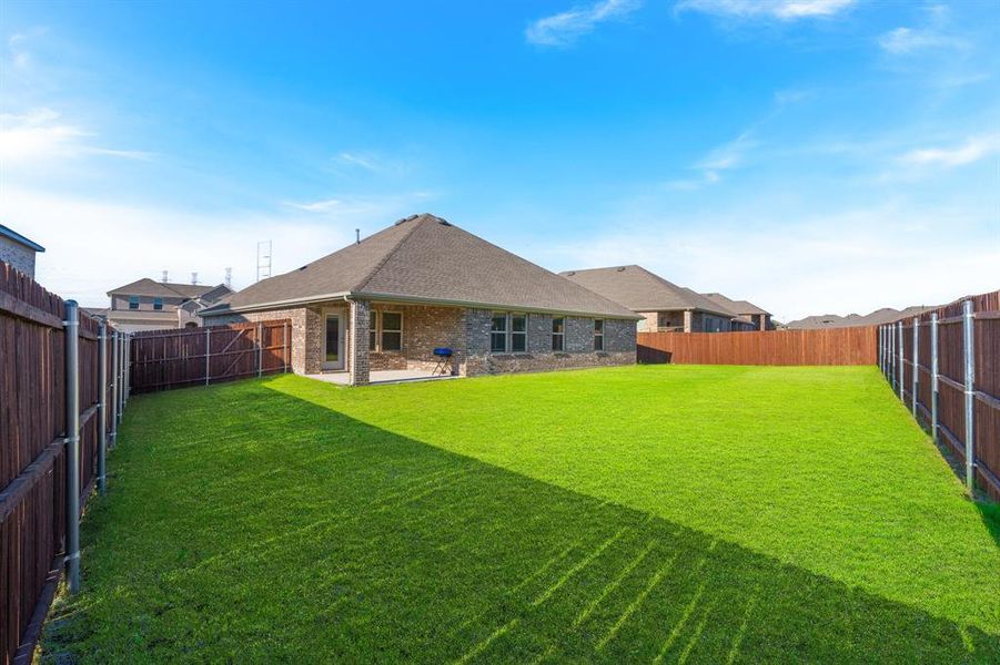 Exterior details and patio area of a home in Fireside by the Lake, Garland (Image 3). Exterior details and patio area of a home in Fireside by the Lake, Garland (Image 3).