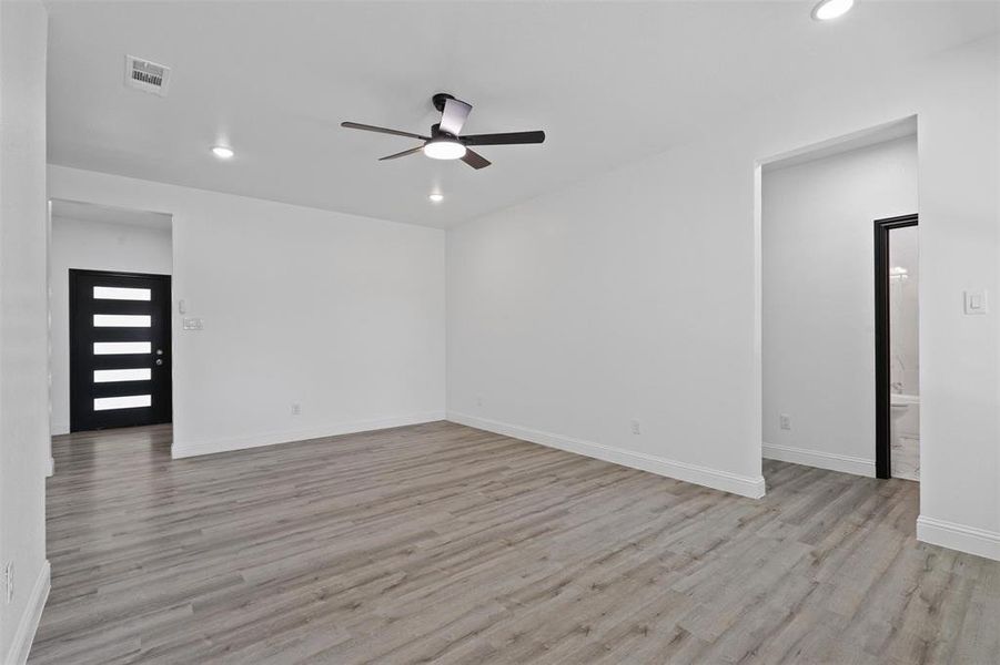 Spare room featuring light hardwood / wood-style floors and ceiling fan