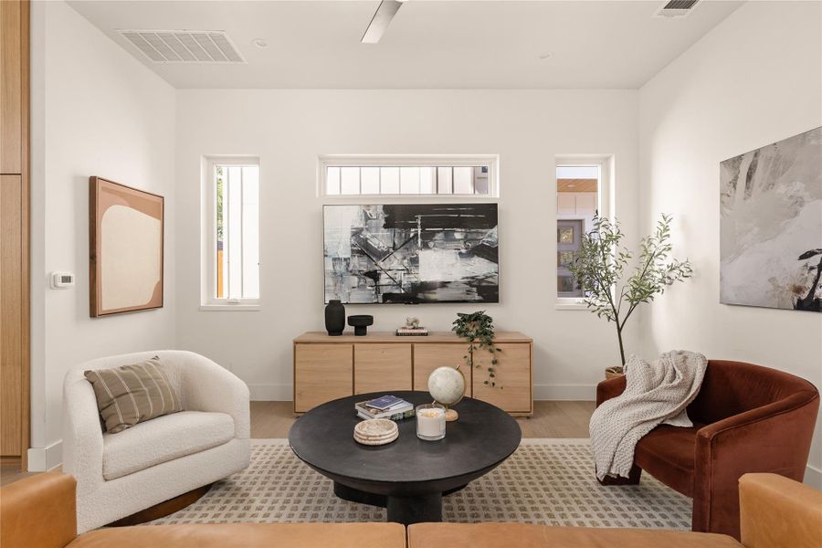 Sitting room featuring wood finished floors and baseboards