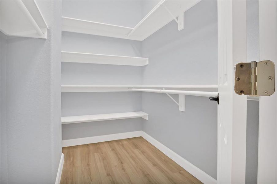 Primary walk-in closet.