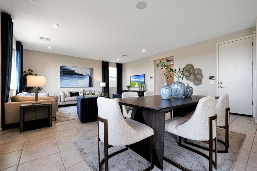 A room with a table and chairs.