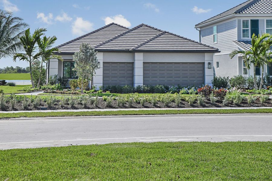 Representative exterior photo of a completed home built from the Meadow Brook by Neal Communities in SkySail, Naples, FL (Image 20).