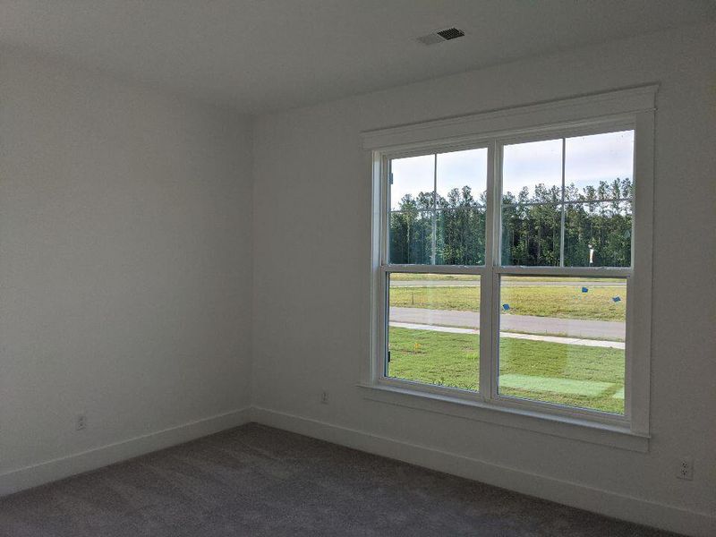Spacious, unfurnished interior of a new home in The Enclave at French Quarter Creek, Huger (Image 12).
