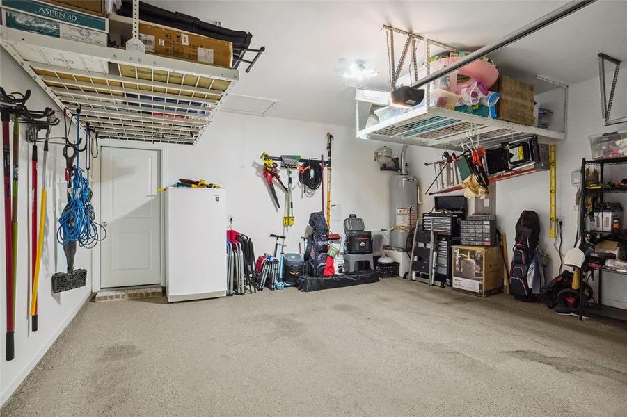 Garage featuring gas water heater-additional  storge