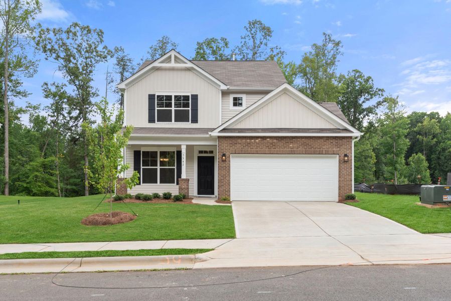 Front exterior of a new home in Chandler Ridge, McLeansville, NC, highlighting curb appeal (Image 1). Front exterior of a new home in Chandler Ridge, McLeansville, NC, highlighting curb appeal (Image 1).