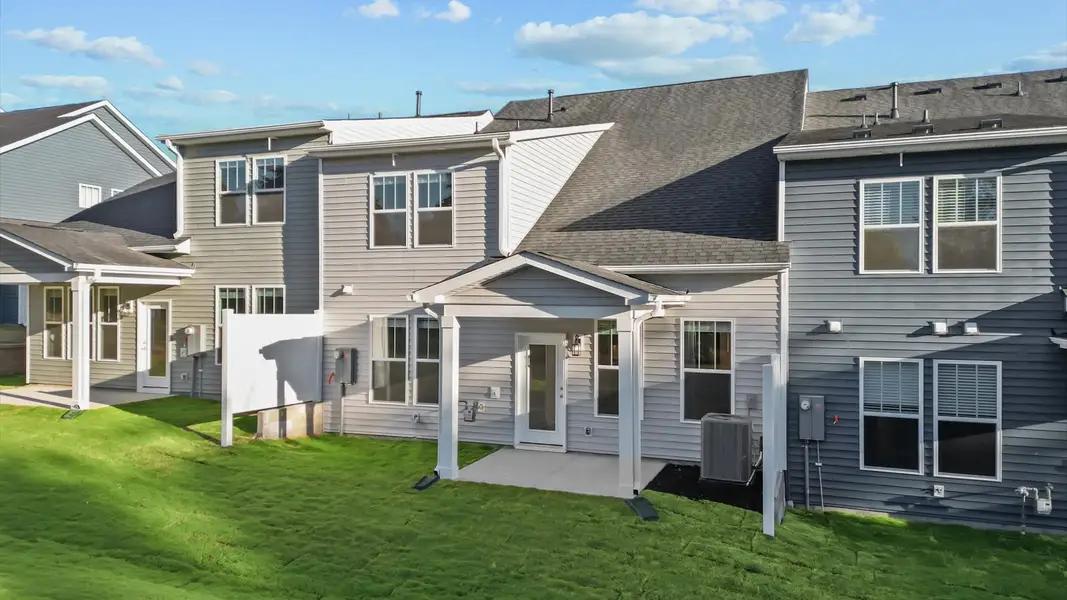 Refined rear exterior with a stylish covered porch for dining, relaxing, or entertaining