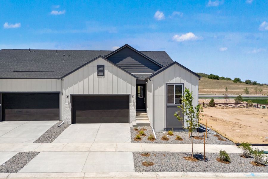 Front exterior of a new home in Trumark Homes at Tanterra, Parker, CO, highlighting curb appeal (Image 1). Front exterior of a new home in Trumark Homes at Tanterra, Parker, CO, highlighting curb appeal (Image 1).