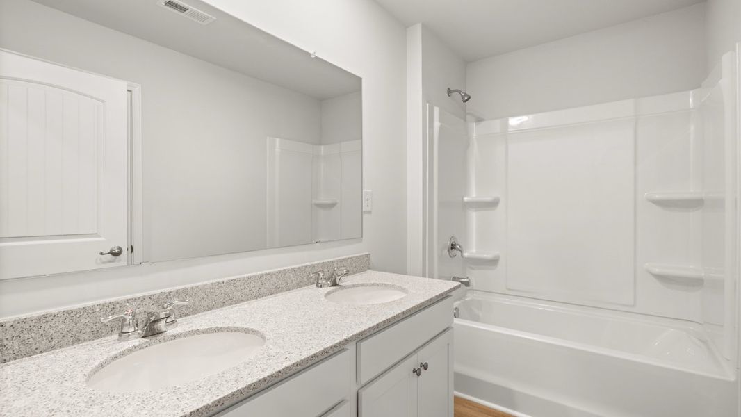 Representative furnished interior of a home built from the Salem by D.R. Horton in Sheffield Highlands, Dallas (Image 10).