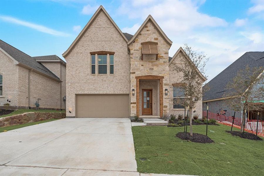 Front exterior of a new home in Hillside Village, Celina, TX, highlighting curb appeal (Image 24).