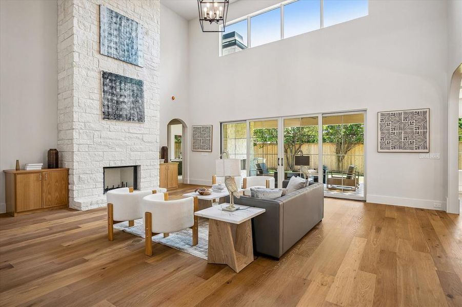 Stone fireplace, triple sliding glass doors to covered patio, hardwood floors Stone fireplace, triple sliding glass doors to covered patio, hardwood floors