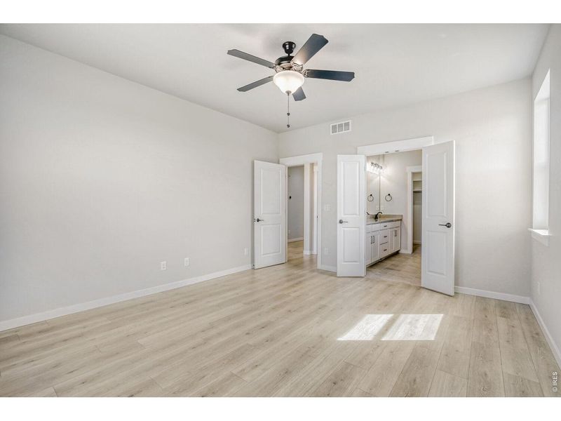 Spacious, unfurnished interior of a new home in RainDance, Windsor (Image 26).