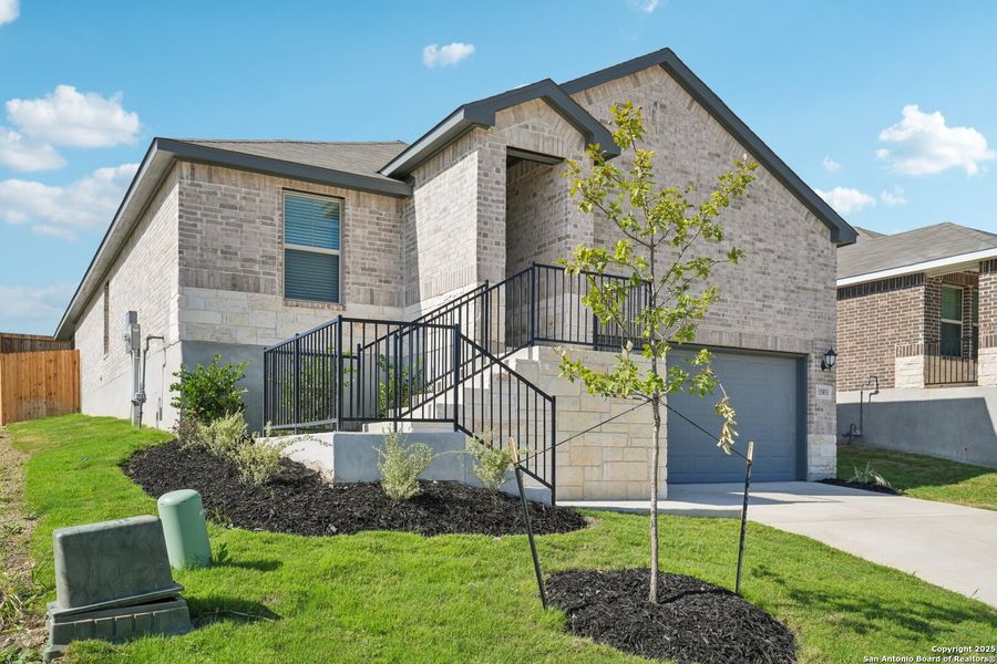 Front exterior of a new home in Comanche Ridge, San Antonio, TX, highlighting curb appeal (Image 22). Front exterior of a new home in Comanche Ridge, San Antonio, TX, highlighting curb appeal (Image 22).