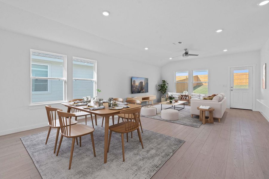 Dining area with recessed lighting, light wood-style floors, a ceiling fan, and lofted ceiling