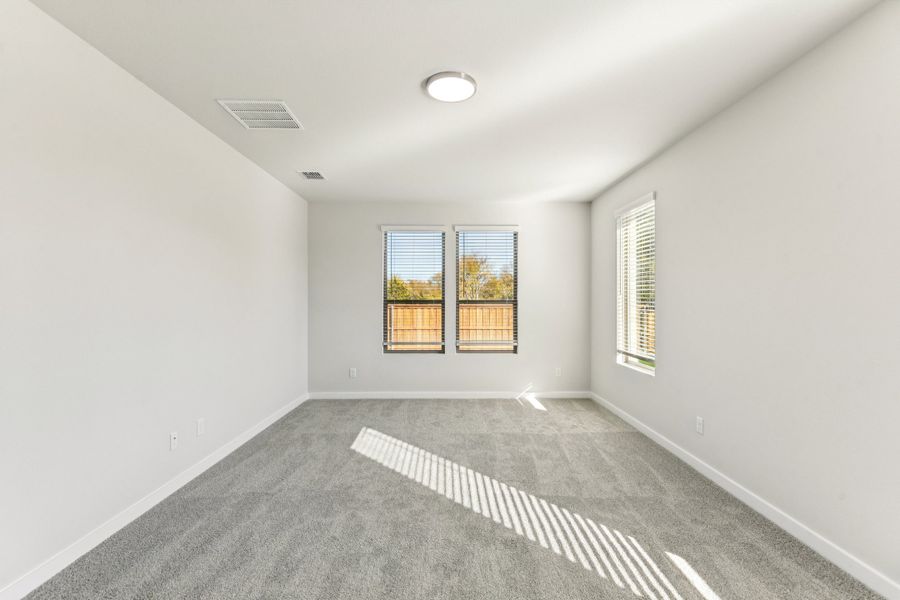 Primary Suite in the Wimbledon home plan by Trophy Signature Homes – REPRESENTATIVE PHOTO