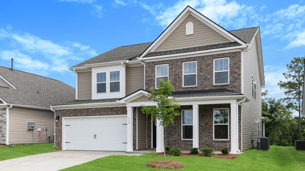 Front exterior of a new home in Adams Glen, Greenville, SC, highlighting curb appeal (Image 2). Front exterior of a new home in Adams Glen, Greenville, SC, highlighting curb appeal (Image 2).