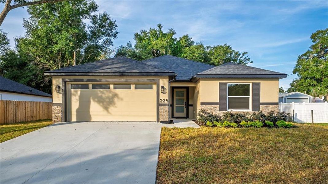 Front exterior of a new home in , Umatilla, FL, highlighting curb appeal (Image 30). Front exterior of a new home in , Umatilla, FL, highlighting curb appeal (Image 30).