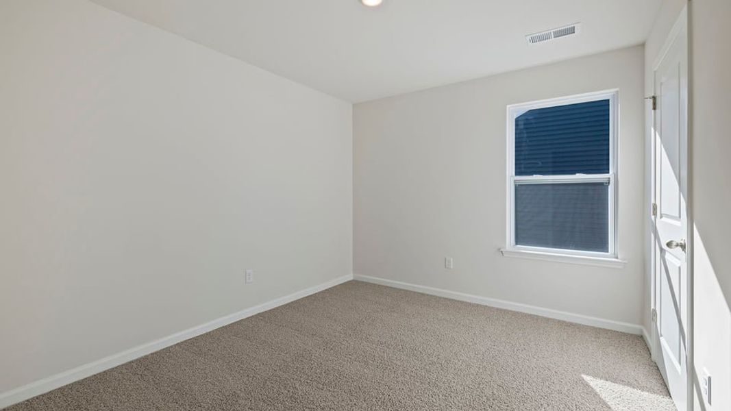 Spacious, unfurnished interior of a new home in Bentley Park, Greenwood (Image 27).