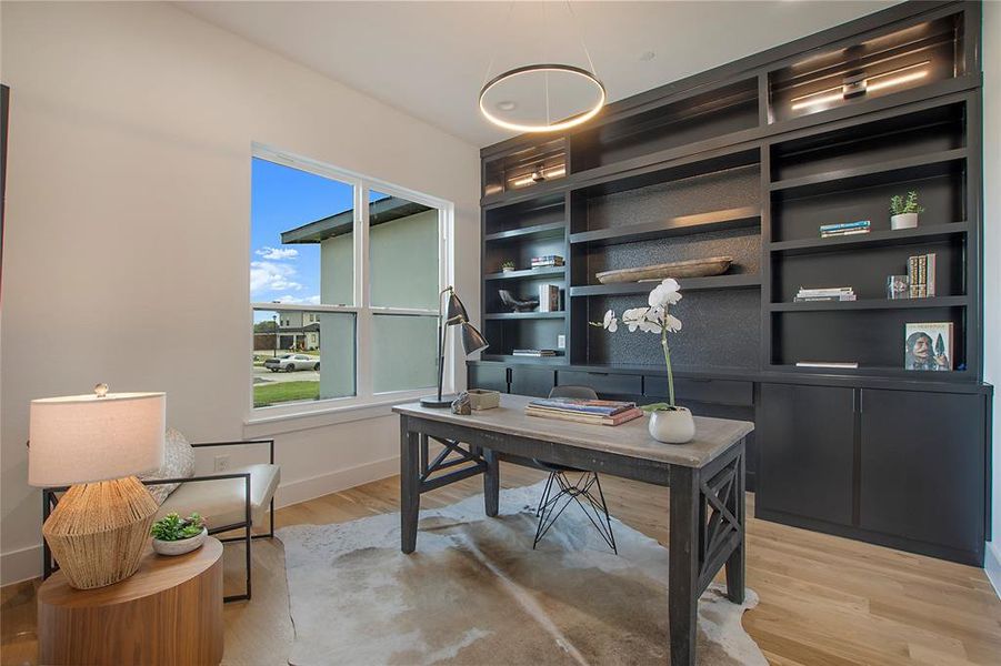 Office space featuring light hardwood / wood-style floors