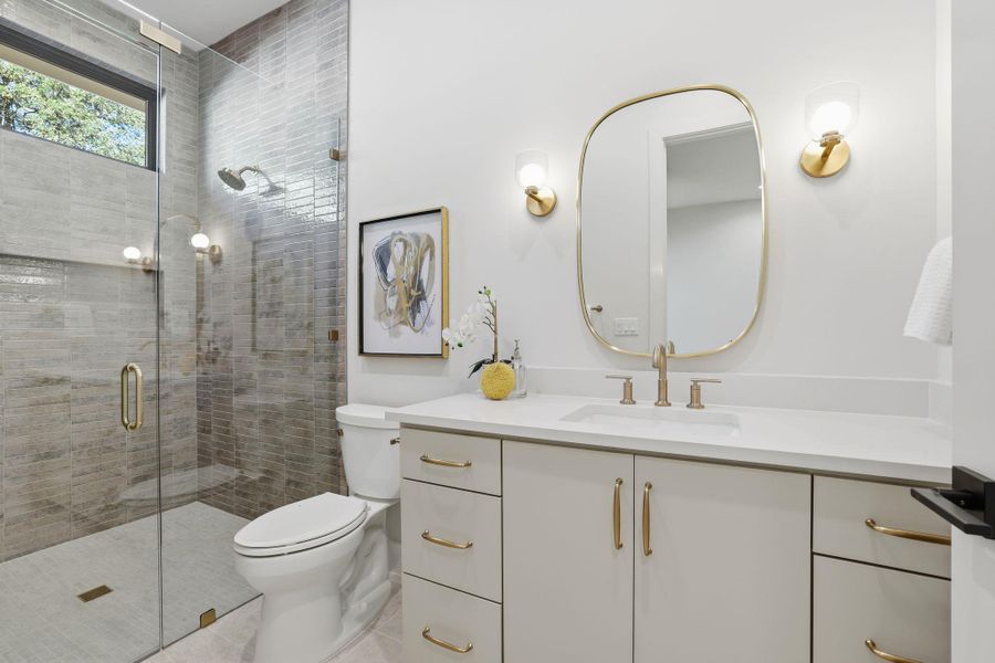 Full bathroom with vanity, a shower stall, and light tile patterned floors