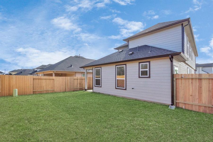 Come and see this spacious backyard with its beautiful covered patio. There is plenty of room for the kids to play and adults to relax. Perfect for your outdoor living space, patio furniture, bbq pit, and so much more. Sample photo of completed home with similar floor plan. As-built interior colors and selections may vary.