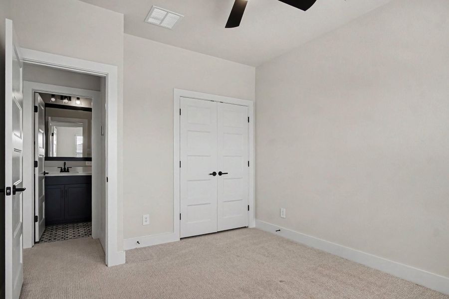 Additional upstairs bedroom with window blinds and ceiling fan. Additional upstairs bedroom with window blinds and ceiling fan.
