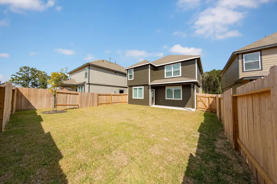 Exterior details and patio area of a home in Mackenzie Creek, Conroe (Image 3). Exterior details and patio area of a home in Mackenzie Creek, Conroe (Image 3).