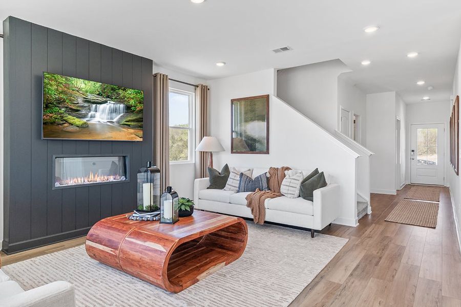A living room with a fireplace.