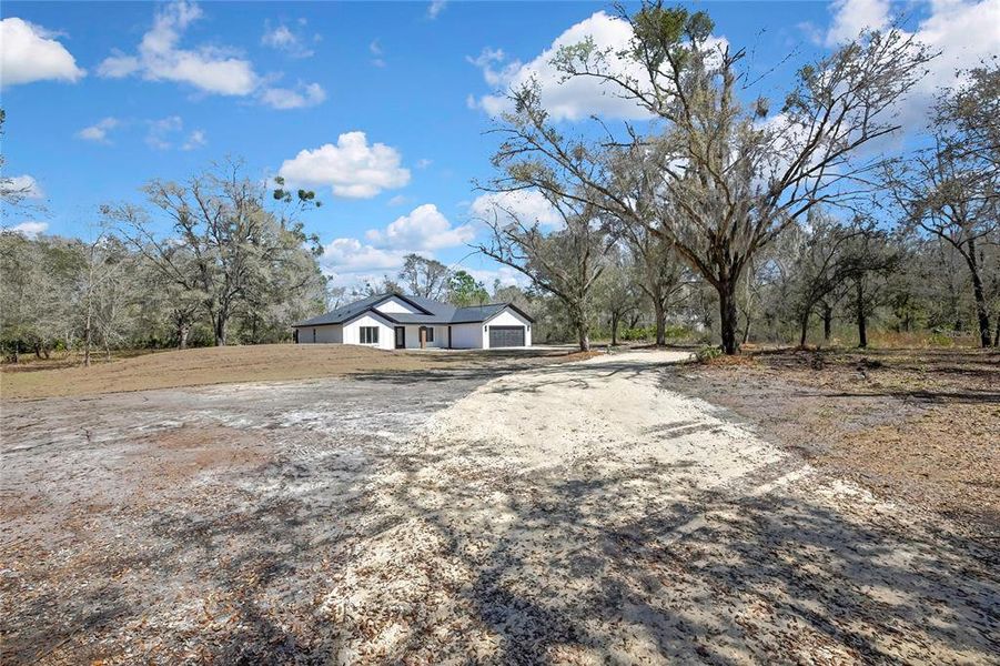 Front exterior of a new home in , Crystal River, FL, highlighting curb appeal (Image 26).