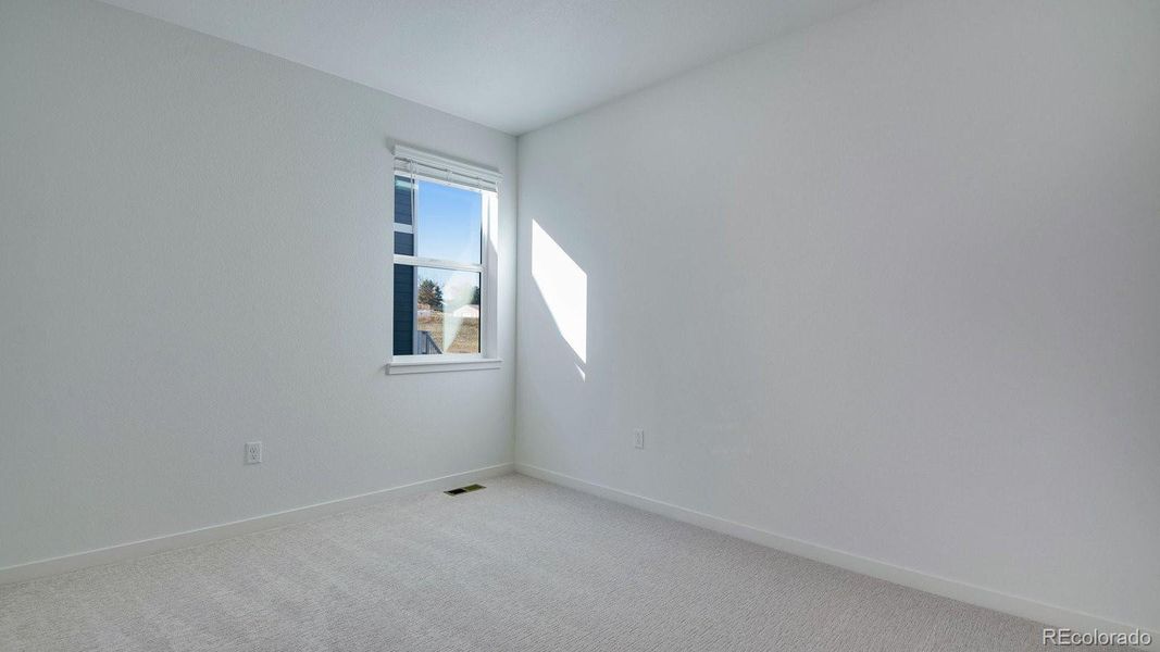 Spacious, unfurnished interior of a new home in Trails at Crowfoot, Parker (Image 31).