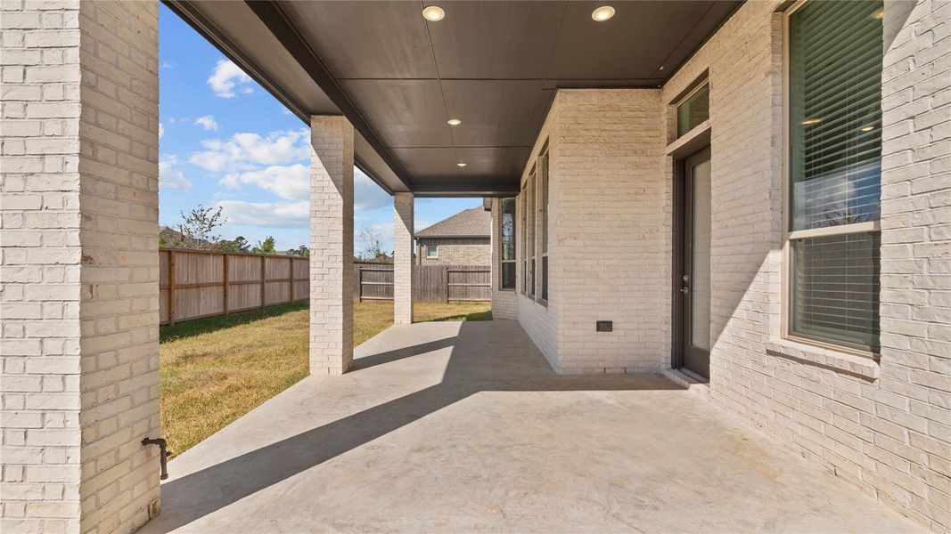 Exterior details and patio area of a home in , Conroe (Image 4). Exterior details and patio area of a home in , Conroe (Image 4).