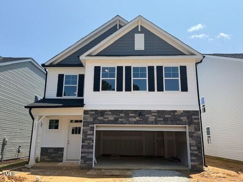 Front exterior of a new home in Gregory Village, Lillington, NC, highlighting curb appeal (Image 53).